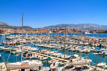Fototapeta na wymiar Coastal summer cityscape - view of the marina of Split with yachts moored, the Adriatic coast of Croatia