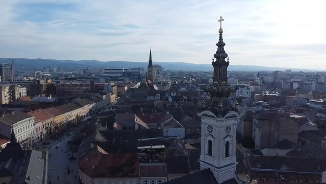 Aerial of a clock tower of a church in Linz city, Austria with the cityscape in the background