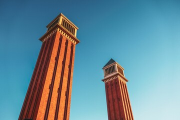 A low angle shot of the Venetian Towers in Barcelona, Spain