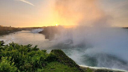 Fototapeta na wymiar Scenic view of Niagara Falls in Canada at golden sunrise