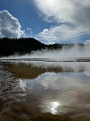 Scenic outdoor landscape of a tranquil lake surrounded by lush greenery
