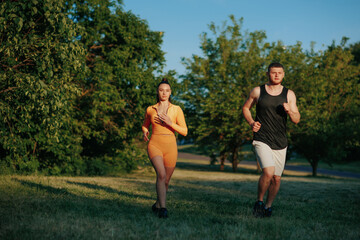 Exuding athleticism and determination, a sportswoman and her male personal trainer engage in a joint running exercise, embracing an active lifestyle and healthy living.