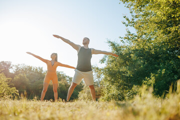 Morning Gymnastics Two People Practicing Physical Exercise. Active and Strong Male and Female Athletes Exercising Outdoors, Athleticspirit