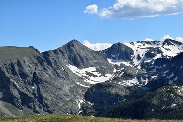 Fototapeta premium Summer Snow Cornices Remain atop Mountains
