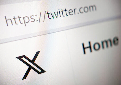 Twitter website UI is updated with new X logo after Elon Musk's rebranding in 2023, closeup page displayed on a computer screen