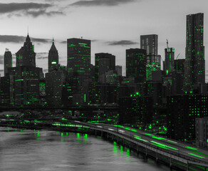 Green lights shining in black and white cityscape with the downtown Manhattan skyline buildings of New York City at night time