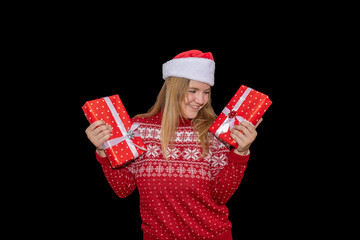 Young blue-eyed blonde girl with happy attitude holding some gifts on black background. Light-eyed...