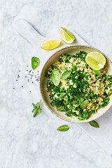 Bulgur-kale tabbouleh with herbs and lime-garlic dressing. Top view. Copy space - 637128398