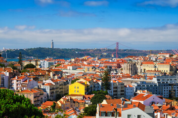 Lisbon famous view from Miradouro dos Barros tourist viewpoint over Alfama old city district, 25th...