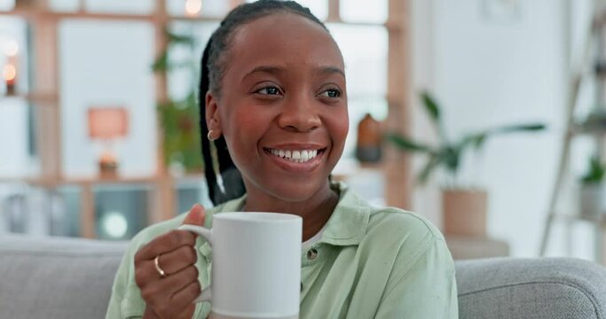 Black woman, drink and thinking with coffee on sofa in living room, apartment or relax in lounge with ideas in morning. Happy, face and drinking tea or beverage with smile in home on weekend or break