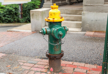 Fire hydrant stands ready, a beacon of safety and preparedness amidst cityscape's hustle,...