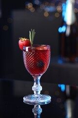 Glass of delicious refreshing sangria on counter in bar