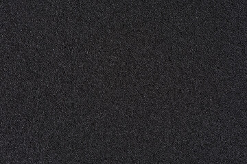 Black soft foam board background. black sponge surface texture. - obrazy, fototapety, plakaty