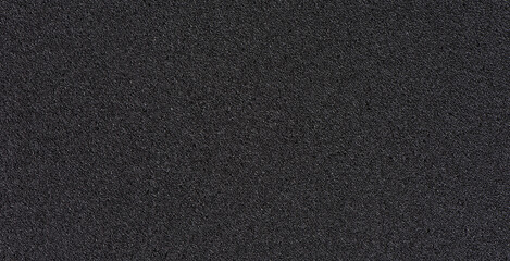 Black soft foam board background. black sponge surface texture. - obrazy, fototapety, plakaty