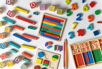 Сolorful math fractions, alphabet letters on white background. interesting math for kids. Education, back to school concept. Geometry, numbers and mathematics materials for preschool or daycare