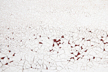 Cracked White Paint on Rusted Surface