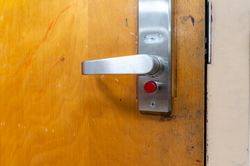 Open classroom door with new door hardware with security locks for a lockdown.