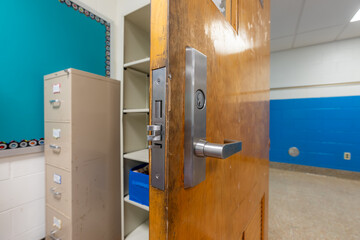 Open classroom door with new door hardware with security locks for a lockdown.