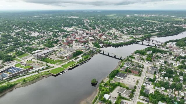 Wide aerial view of the Penobscot River cutting through Bangor, Maine.