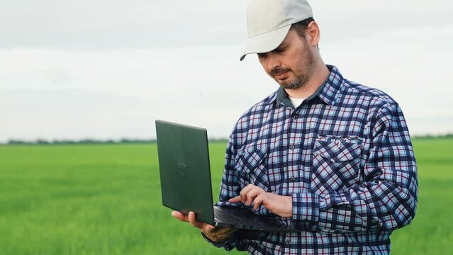 agronomist farmer working laptop computer wheat field, business get profit, count expenses income, agribusiness farm, agrotechnician count harvest, agribusiness count online laptop, print hand