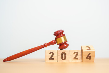 2023 chcnge to 2024 year block with judge gavel on table. Law, lawyer, judgment, justice auction...