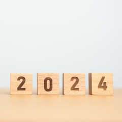 2024 year block on table. goal, Resolution, strategy, plan, start, budget, mission, action,...