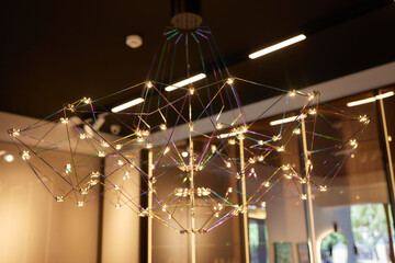 Gold brass copper chandelier, round consisting of gold spikes, rays. Modern beautiful rich design...