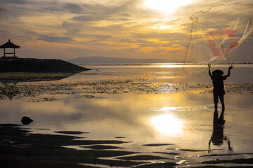 Fisherman throwing a net