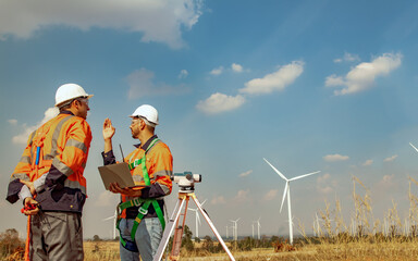 Architect engineer male surveyor team working with surveyor's telescope to measure heights of walk...