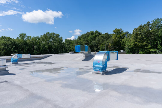Construction of new roof mounted HVAC Ductwork waiting for new Roof Top Units, RTU.	