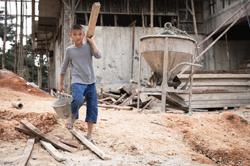 Concept of poverty and child labor, Children who are working on construction sites ,  Against child labor, Poor children,  construction work, Violence children and trafficking concept