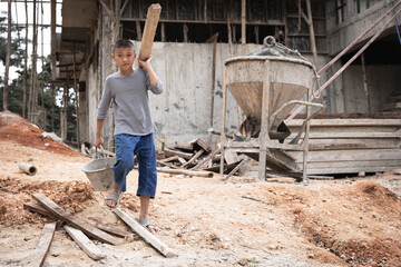 Concept of poverty and child labor, Children who are working on construction sites ,  Against child...