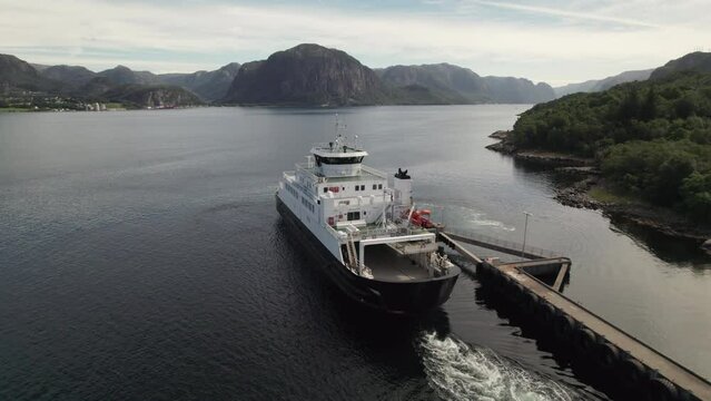Aerial View of a Car Ferry Departing from the Dock to Cross a Beautiful Fjord in Norway, Lauvvika-Oanes, Near Stavanger, Summer Sunny Day