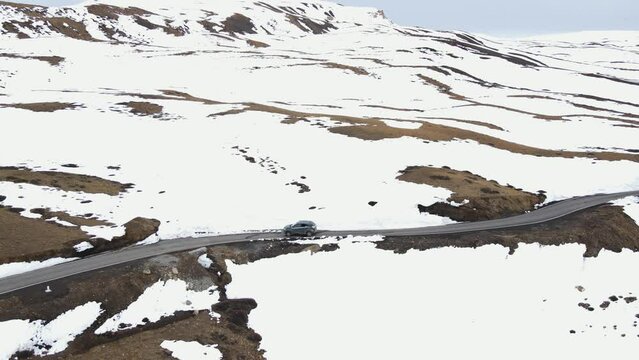 aerial snowy landscape of jeep driving on Komic  a small village located in Spiti Tehsil of Lahaul and Spiti district of Himachal Pradesh  World's Highest Village india