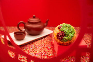 Obraz na płótnie Canvas Mooncake, Moon cake for Mid-Autumn Festival, concept of traditional festive food on table with tea , close up, copy space