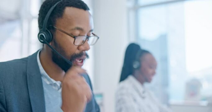 Computer, customer service and a black man consultant working in a call center for support or assistance. Contact, crm and headset communication with an employee consulting in a telemarketing office