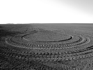 Plowed field for potato in black soil on open countryside nature