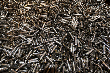 Bullet casings pile in weapon production plant storage
