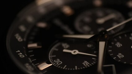 Close-up Macro shot of Watch face passing through 40 seconds. Great Detail, dark watch dial 30fps