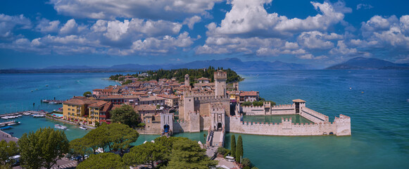 Aerial view to the town of Sirmione, popular travel destination on Lake Garda in Italy. View of the...