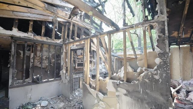 Aftermath of a Burnt Home with a Roof that Caved In