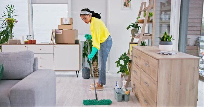 Woman, mop and dirt on living room floor for job, services and hospitality with gloves, safety or bacteria in home. Maid lady, cleaning and house for dust, paper and mess for housekeeping maintenance