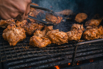 flavorful grilling close-up of chicken on charcoal bbq stove