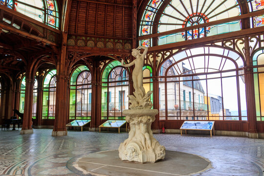 Interior of old Buvette Cachat pump room building near the historical mineral water source in Evian-les-Bains, Haute Savoie, France