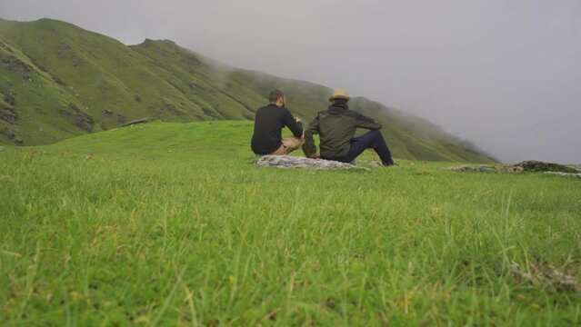 Camping food in nature, guy dine noodles in the Khaliya Top, hiking during vacation, summer vacation trekking, lunch in the mountains, hiking, Uttarakhand, India.