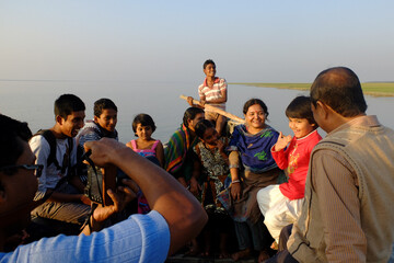 South asian combined family spending their vacation through a journey by boat , family togetherness concept 