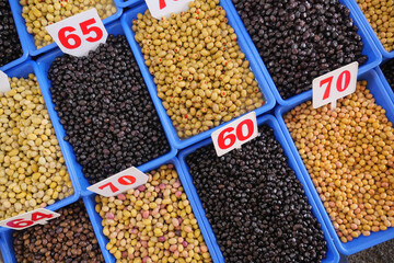 Buckets of olives for sale street food market