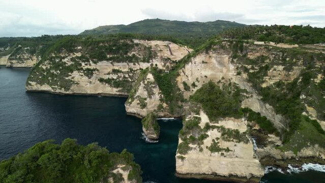Flying away from Nusa penisa Tree House on the Cliffside. Bali Indonesia.