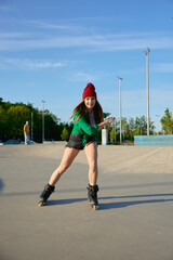 Healthy teenager girl enjoys rollerblading speed moves