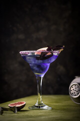 Purple fig cocktail or mocktail in glass